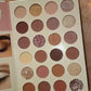 A complete 4-in-1 professional makeup palette for face, eyes, and eyebrows.